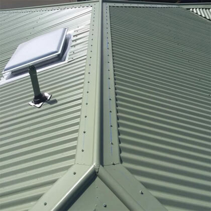 New metal roof installation on a home in George Town by local roofing experts