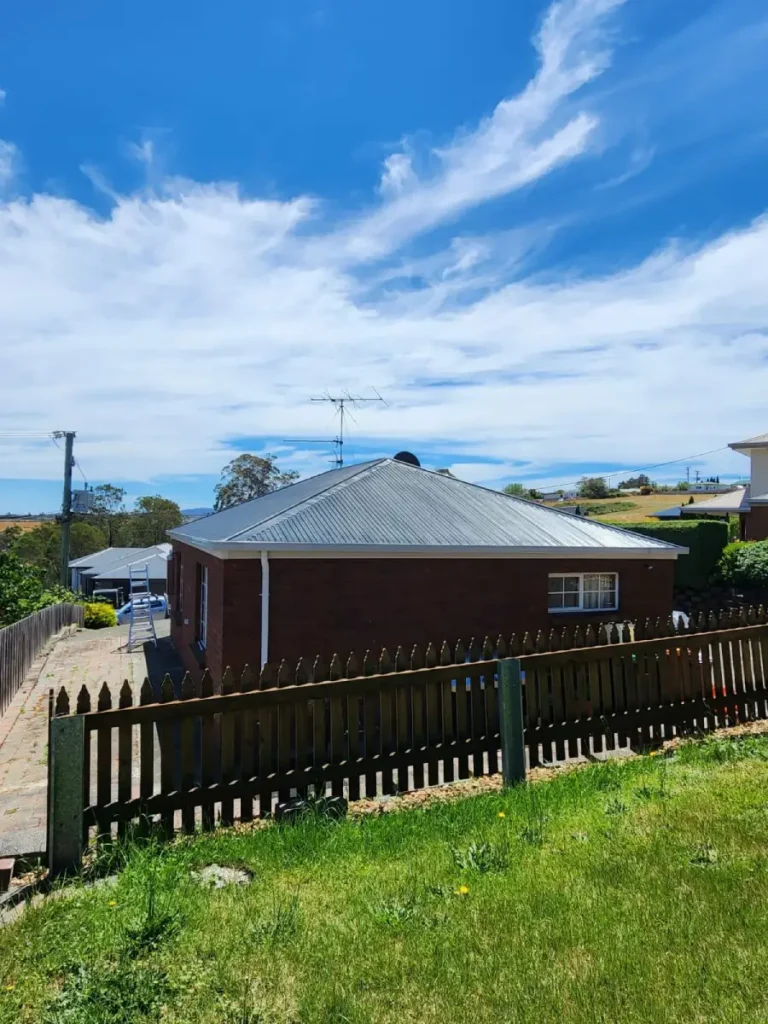 Freshly painted metal roof on a home in Northern Tasmania by local roofers